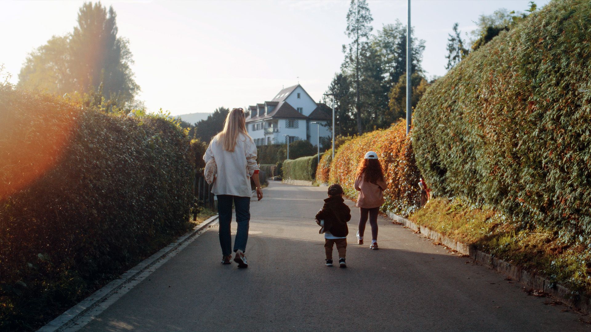 Vero Sallenbach with her children are walking down a street in Stein am Rhein, Schaffhausen, Switzerland.